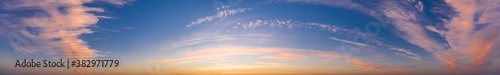 Colorful sky with cirrus clouds during dawn. High resolution panorama. View from drone