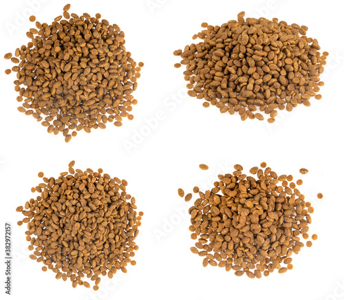 Food for animals isolated white background. Dry cat and dog food texture. Pet meal background close up © Илья Подопригоров