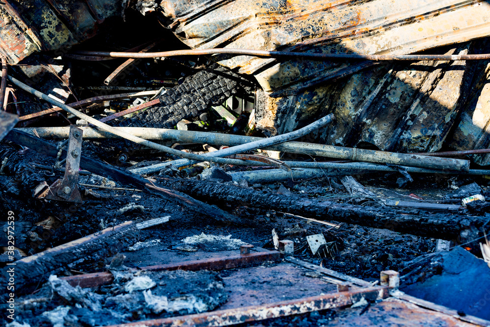 Burned damaged ruins of destroyed sprinkler fire protection system in supermarket. Arson investigation insurance