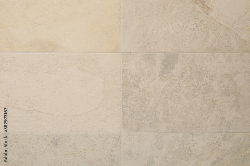 Fototapeta premium Light beige tile background of bathroom wall