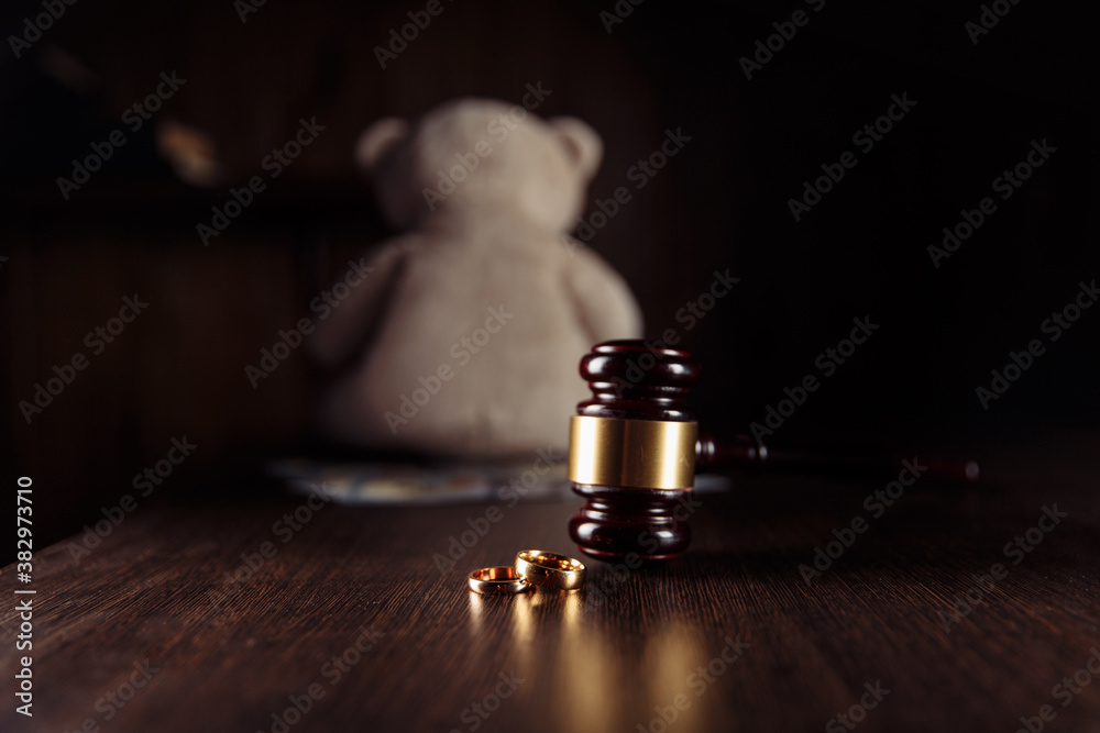 Alimony payment. Dollar banknotes, judge gavel and teddy bear. Family divorce and alimony concept. Alimony payment. Dollar banknotes, judge gavel and teddy bear. Family divorce and alimony concept.