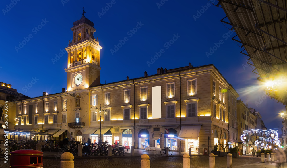 Picture of Parma city hall illuminated at evening, Garibaldi square, Italy .