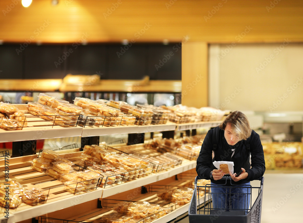 Choosing food from shelf in supermarket,bakery,Grocery stores