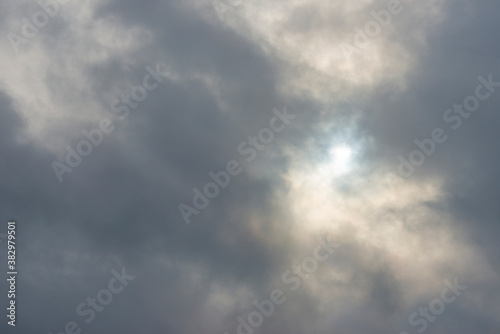 Panorama of dark and white clouds in a rainy sky with the sun piercing through in autumn, Almere, Flevoland, The Netherlands, October 4, 2020 © Naj