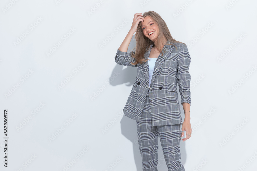 Cheerful fashion businesswoman laughing and fixing her hair Cheerful fashion businesswoman laughing and fixing her hair