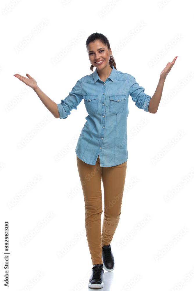 Smiling smart casual woman welcoming and walking Smiling smart casual woman welcoming and walking