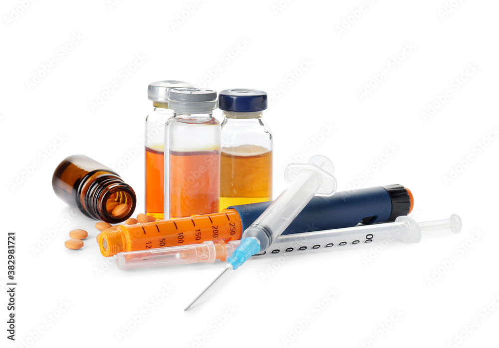 Medications with syringes on white background. Diabetes concept Medications with syringes on white background. Diabetes concept