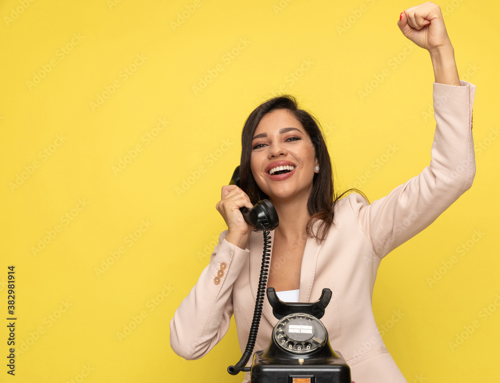 excited young girl in pink suit celebrating victory excited young girl in pink suit celebrating victory