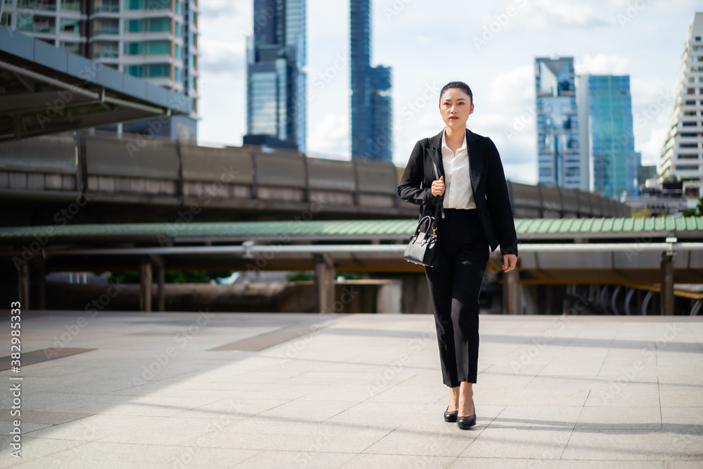 business woman walking in city