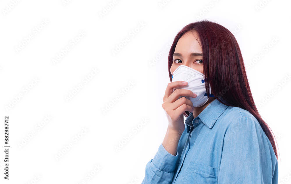 Young women wear face masks to protect disease viruses covid19 and air pollution (PM2.5) or N95 mask safe her healthy problem on isolated white background. Coronavirus and environmental pm2.5 concept. Young women wear face masks to protect disease viruses covid19 and air pollution (PM2.5) or N95 mask safe her healthy problem on isolated white background. Coronavirus and environmental pm2.5 concept.