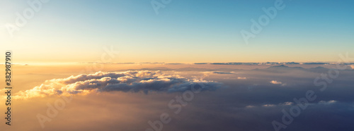 A panoramic top view of sunrise or sunset and over all clouds under the blue sky  Sky and clouds banner  wallpaper concept.