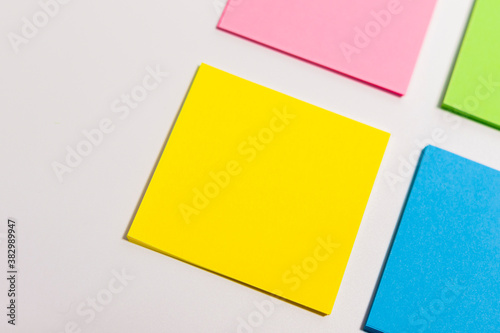 Sheets of paper of different colors are arranged diagonally.