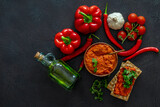 Traditional autumn Balkan vegan spread Ajvar or Aivar with ingredients. Homemade relish. Top view, copy space