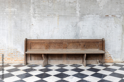 Принти на полотні front view of old single wooden bench on checkered pattern marble tiles floor wi