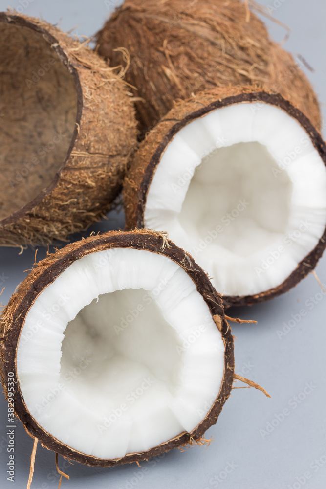 Two halves of fresh coconut and coconut shell Two halves of fresh coconut and coconut shell