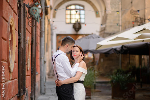 Beautiful stylish couple on a date on the streets in the old city.