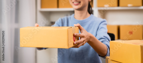 Startup small business, Young women holding box delivery products to customers, Ordered online.