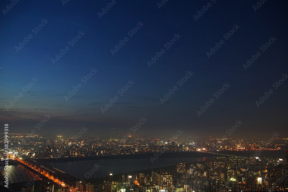The river of the city of Osaka, Japan and night view of the light of the town