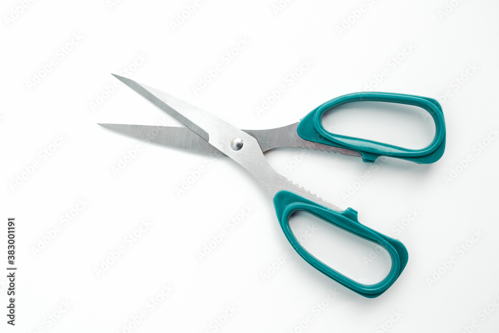 Green scissors isolated on a white background. Green scissors isolated on a white background.