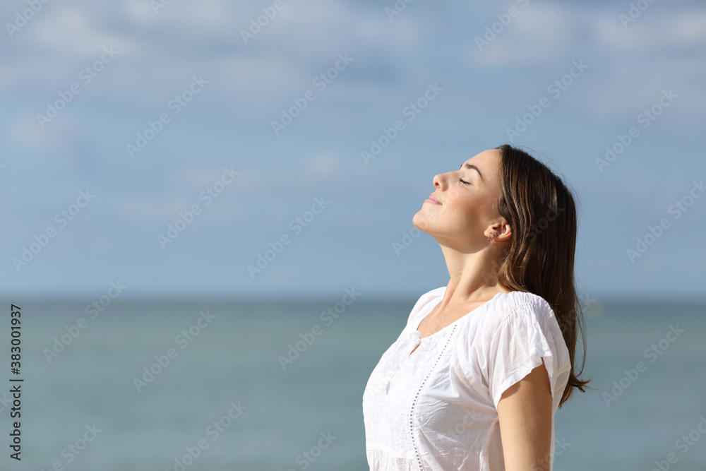 Teen breathing fresh air on the beach a sunny day Teen breathing fresh air on the beach a sunny day