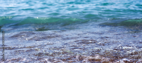 Soft wave of sea on sandy beach. Background.