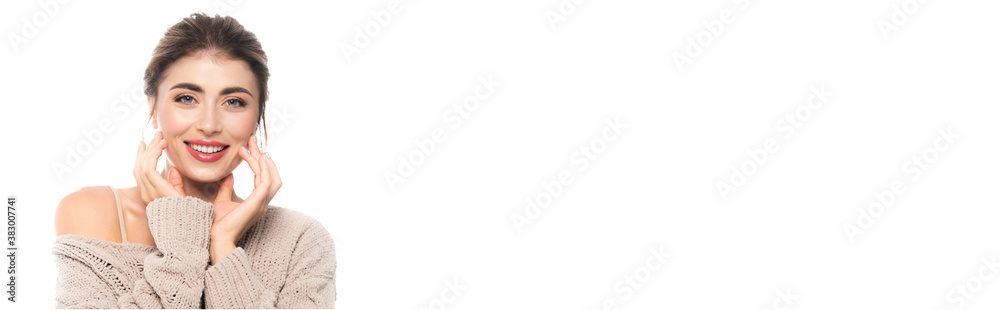 horizontal image of woman in knitted sweater touching face while looking at camera isolated on white horizontal image of woman in knitted sweater touching face while looking at camera isolated on white