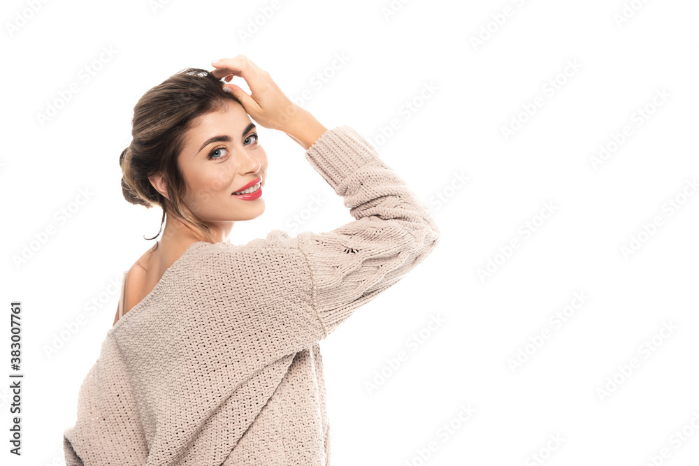 elegant woman in knitted sweater posing with hand near head isolated on white elegant woman in knitted sweater posing with hand near head isolated on white