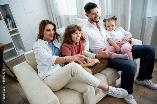 Family with small kids sitting and relaxing