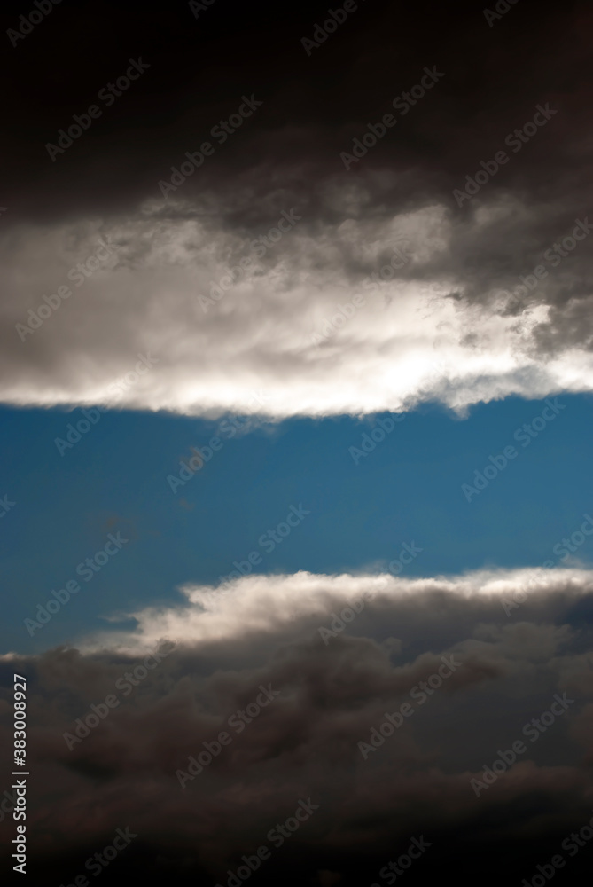Tunnel in the clouds - dark clouds forming a tunnel in the sky. Tunnel in the clouds - dark clouds forming a tunnel in the sky.