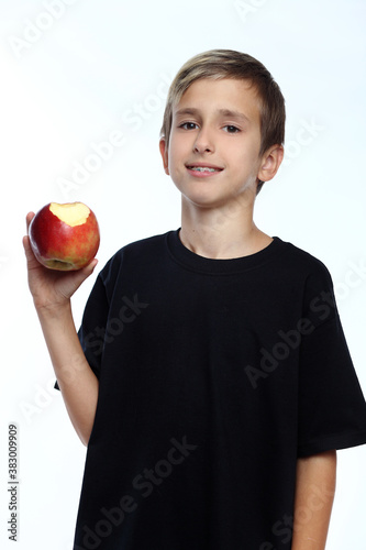 Boy holding an apple photo