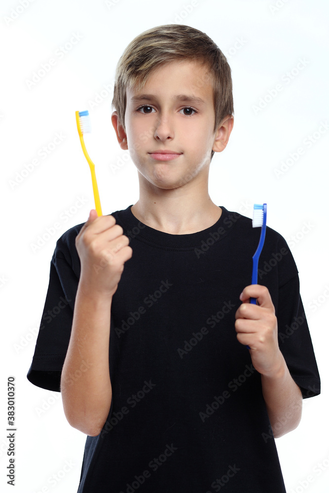 adorablee boy holding toothbrush and smiling at camera isolated on white adorablee boy holding toothbrush and smiling at camera isolated on white