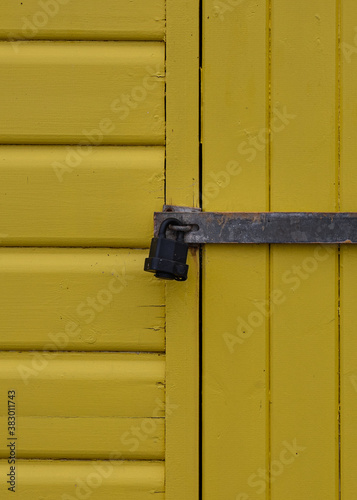 Padlocked Yellow Beach Hut Door