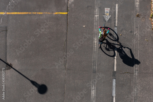 Topview on dirty asphalt road with grunge signs and bicycles with shadows