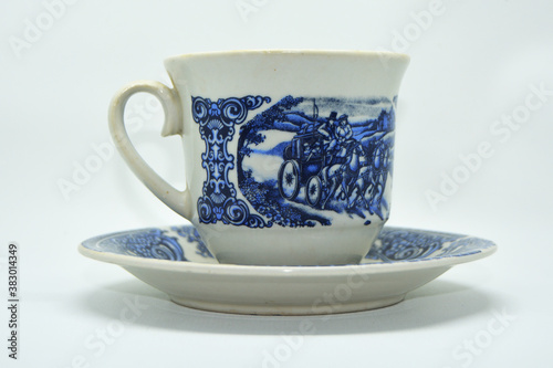 The cup has a classic blue pattern with a white background