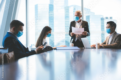A group of businessmen meet...