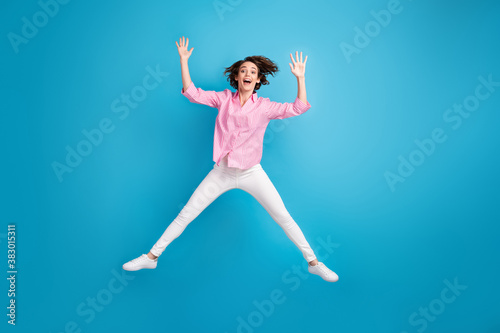 Full length photo of active careless girl jump wear pink white formal outfit isolated over blue color background