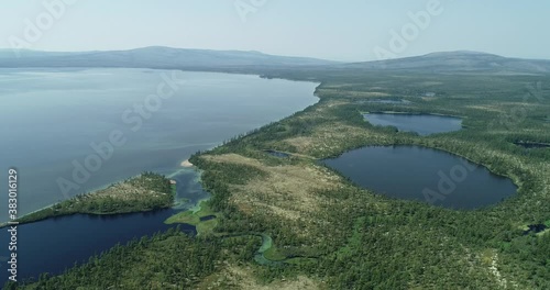 Sea bay surrounded by mountains. Peninsula Kony. The Sea of Okhotsk. Magadan Region. Russia. photo