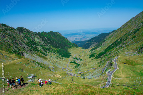 TRANSFAGARASAN, ROMANIA - Aug 31, 2020: Tourists admiring the serpentines of the Transfagarasan road from the Fagaras mountains - Romania