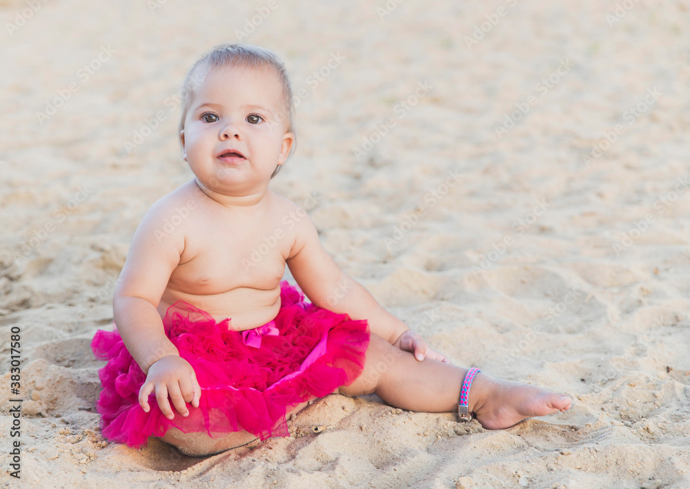 babe in pink skirt sunbathing on the beach babe in pink skirt sunbathing on the beach