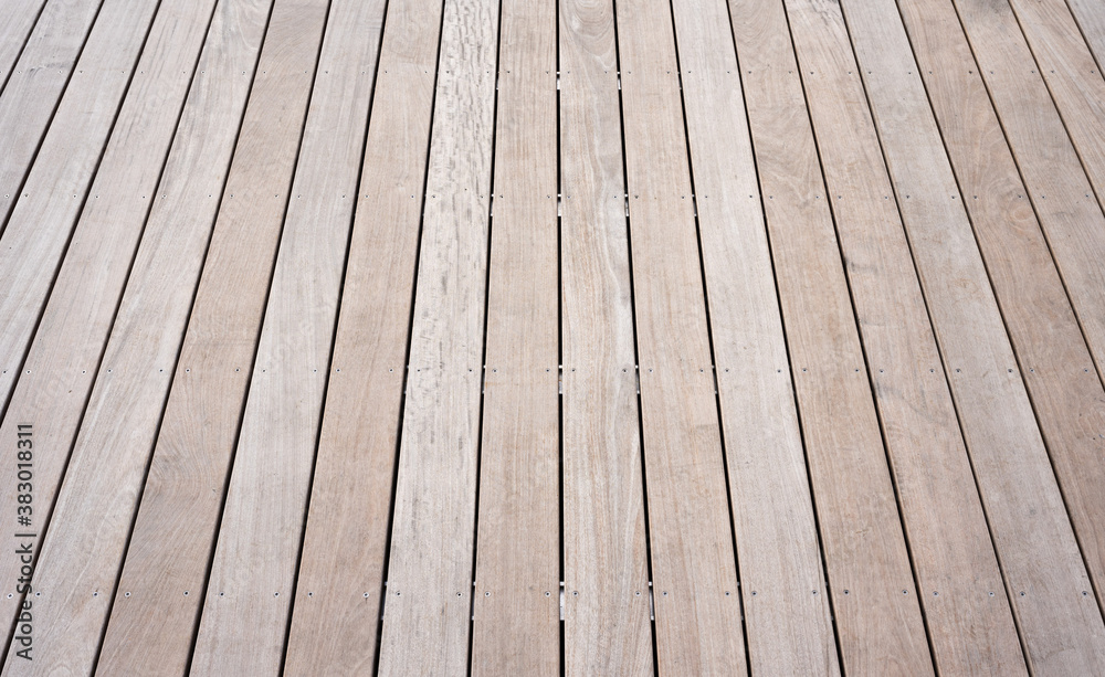 A terrace with new wooden planks of smooth resistant water-repellent tropical wood A terrace with new wooden planks of smooth resistant water-repellent tropical wood