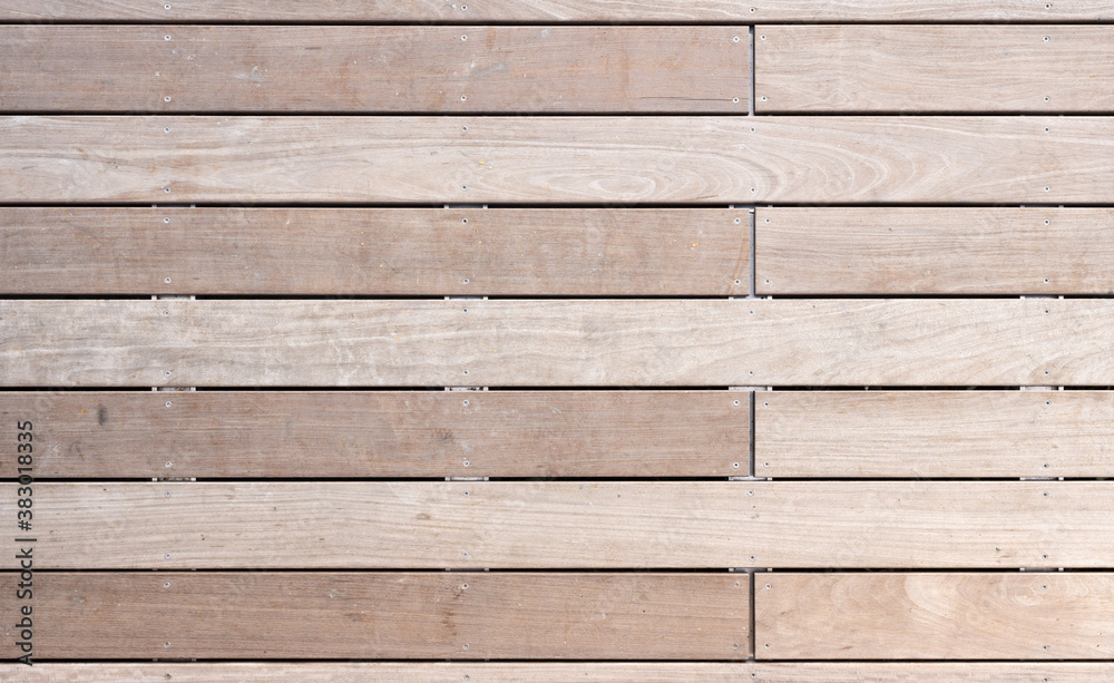 Obraz premium A terrace with new wooden planks of smooth resistant water-repellent tropical wood