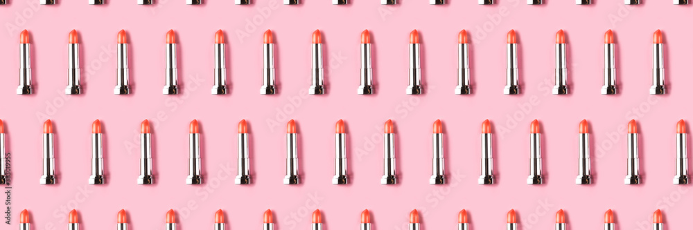 Obraz premium Banner made from lipsticks on pink background.