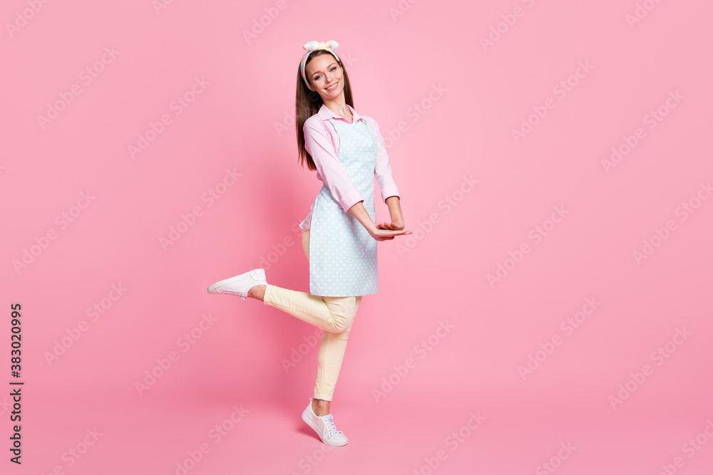 Full size photo of pretty charming girl enjoy home house free time wear good look clothes sneakers isolated over pastel color background Full size photo of pretty charming girl enjoy home house free time wear good look clothes sneakers isolated over pastel color background