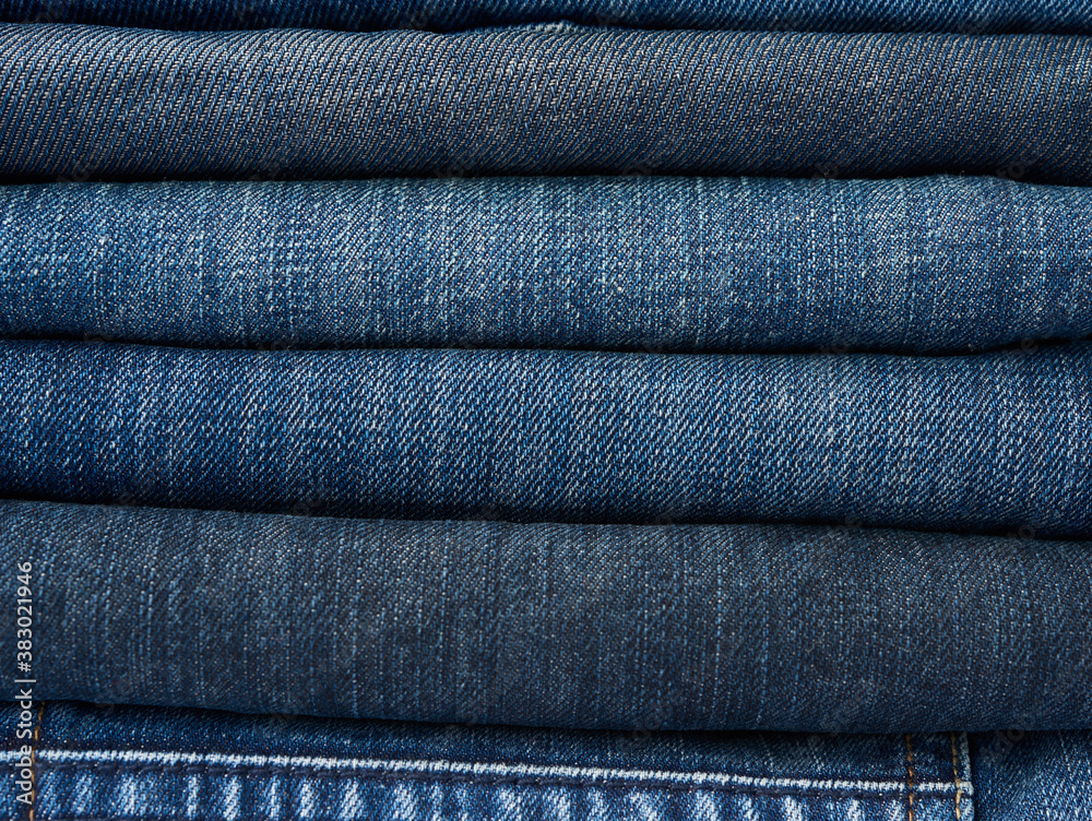 stack of assorted blue jeans stack of assorted blue jeans