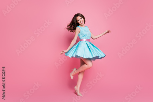 Full size profile photo of wavy charming lady having fun festive event prom party dancing good mood night club chill skirt flying wear blue mini dress stilettos isolated pink color background