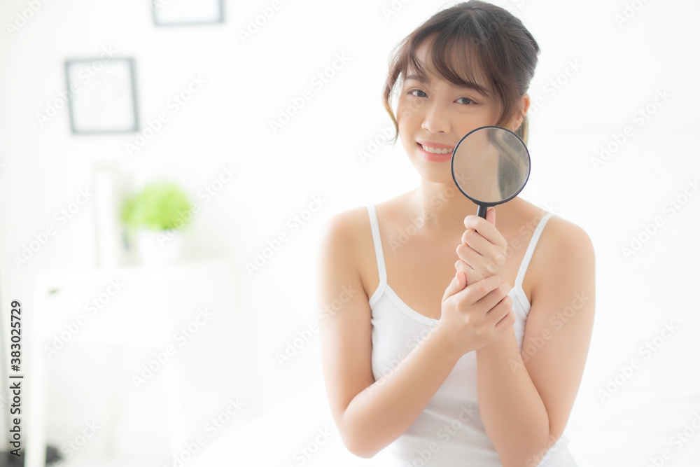 Beautiful young asian woman happy with magnifying skin of acne, beauty asia girl smiling check skincare of face, female analyzing trouble, cosmetic and makeup, health care and wellness concept. Beautiful young asian woman happy with magnifying skin of acne, beauty asia girl smiling check skincare of face, female analyzing trouble, cosmetic and makeup, health care and wellness concept.