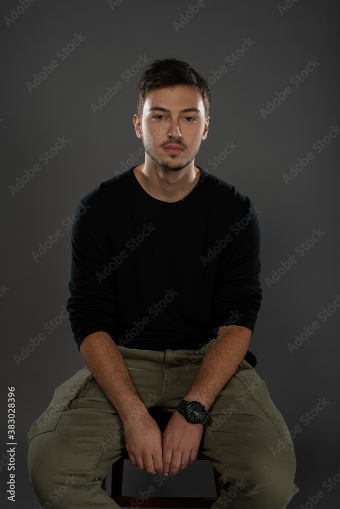Portrait of an actor boy posing in studio on grey background. Isolated