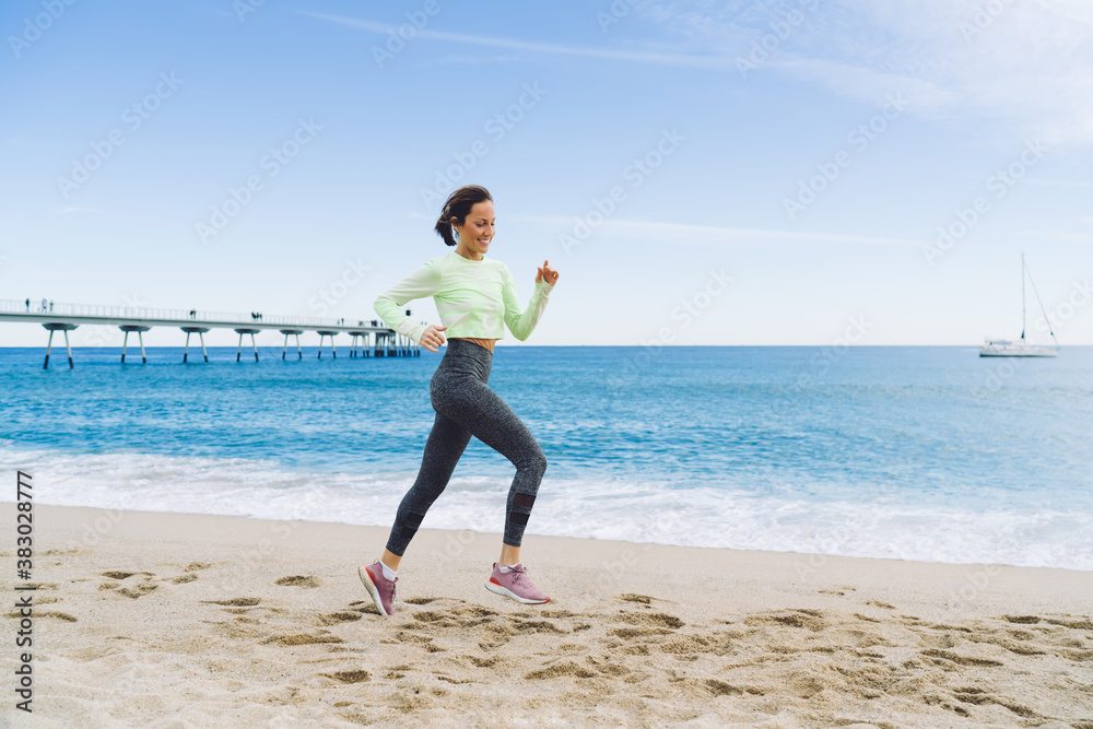 Determined Caucasian woman in active wear running outdoors training strength and vitality on healthy lifestyle, happy female athlete jogging during cardio workout for lose weight and keep fit Determined Caucasian woman in active wear running outdoors training strength and vitality on healthy lifestyle, happy female athlete jogging during cardio workout for lose weight and keep fit
