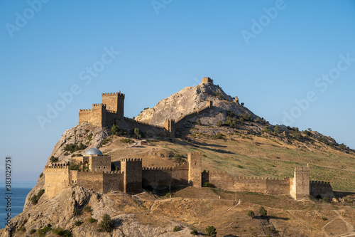 old castle in the mountains against the blue sky, old defensive fortress