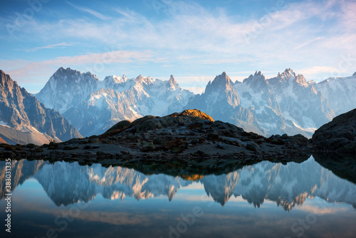 Incredible view of clear water and sky reflection on Chesery lake (Lac De Cheserys) in France Alps. Monte Bianco mountains range on background. Landscape photography, Chamonix.